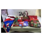 assortment of Christmas table cloths, table