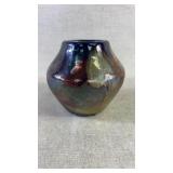 A multi colored glazed pottery signed by Waynes