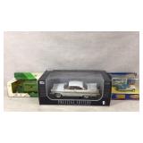 Model cars and John Deere coin bank