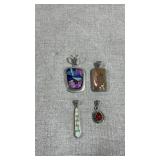 collection of sterling silver jewelry pendants,