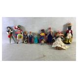 11 handmade cloth dolls from various cultures.