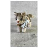 A vintage Steiff tabby kitten with a blue scarf