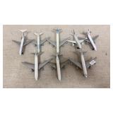 7 small airplane about 4in long, 1 needs cleaning