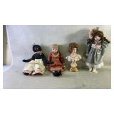 Four dolls including black Americano and a doll