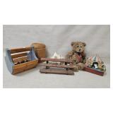 Baskets, teddy bear, toy bench, sea shell and a