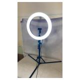 Ring light, powers on, adjustable height and light