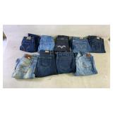 Nine pairs of blue womenï¿½s jeans from brands