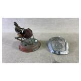 A vintage tin toy and vintage Ford truck hood