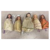 5 miniature dolls