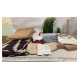 Hand rags, blanket, towels, shower curtain, plants