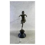 After degas a bronze sculpture of a running girl