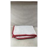 Quilted Fabric Mat With Red Trim and White Body