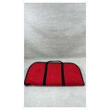 red soft carry case designed for a takedown rifle