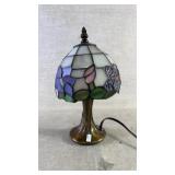 A small Tiffany style stained glass table lamp