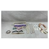 collection of vintage costume jewelry including