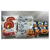 sets of Peanuts brand holiday throw pillows