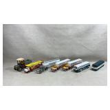 collection of diecast model trucks and buses,