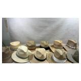 collection of various straw fedora and sun hats