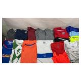 Assortment of menï¿½s dry fit shirts and tank tops