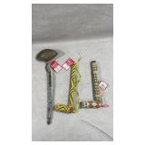 traditional beaded ceremonial pipes and a war club