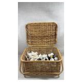 wicker basket containing various sewing