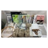 collection of various crafting supplies and books.