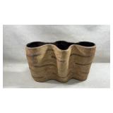 vintage ceramic vase features a distinctive