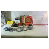 Assortment of tools, nuts, and saw blades