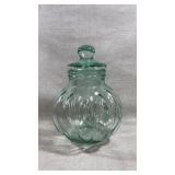 vintage green glass apothecary jar designed in a