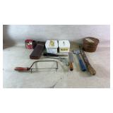 Assortment of tools, honing stones, whetstones,