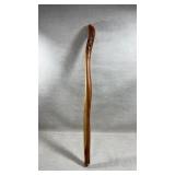handcrafted wooden walking stick featuring a