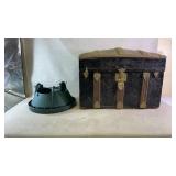 A wooden storage chest and tree holder