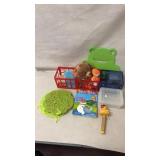 Kids toys, storage baskets and felt frog-shaped