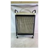 A rolling laundry hamper