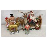 Figurines including Santa, reindeer, nativity.