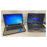 2 Windows 7 laptops, both power on with charger,