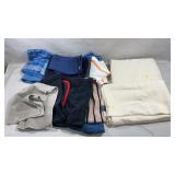assorted kitchen linens, including table cloths,