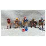 collection of action figures from the Masters of