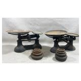 Two vintage cast iron balance scales and a set of