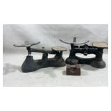 Two vintage cast iron balance scales with one