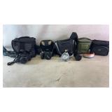 Assortment of cameras, camera cases and