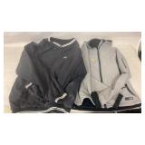 black windbreaker jacket and a grey softshell