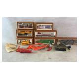 Assortment of tyco train cars and accessories