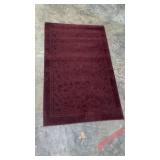 Rectangular Dark Red Textured Area Rug