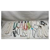 collection of costume jewelry featuring various