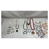collection of vintage costume jewelry, including