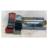 Three sets of different sized drill bits