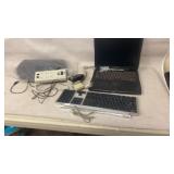 Keyboard, mouse, power stripe and laptop