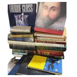 Books including Lalique Glass and Shakespeare.