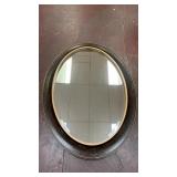 oval Florentine-style wall mirror